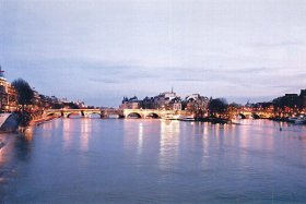 A tranquil winter evening view over the River Seine and Pont Neuf, the oldest bridge in Paris