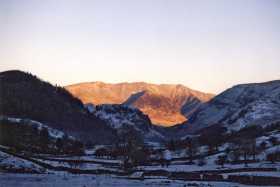 Blencathra is lit up by the morning sun whilst Thirlmere remains in twilight