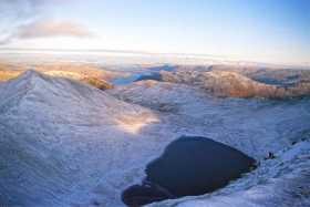 Red Tarn frozen in place between Swirral and Striding Edges