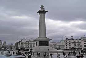 Nelson's Column in Trafalgar Square - a sense of scale is provided by the nearby buses