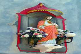 The Sacred Heart, one of many shrines adorning houses on Burano