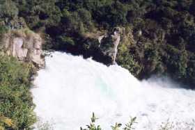 A huge volume of water pours over the Huka Falls