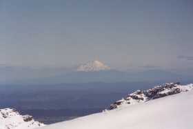 The Mt Taranaki volcano dominates the horizon despite being over 100 miles away