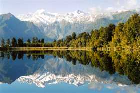 Beautiful morning reflections of Mt Cook and Mt Tasman in Lake Matheson